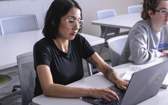 Student at computer in class